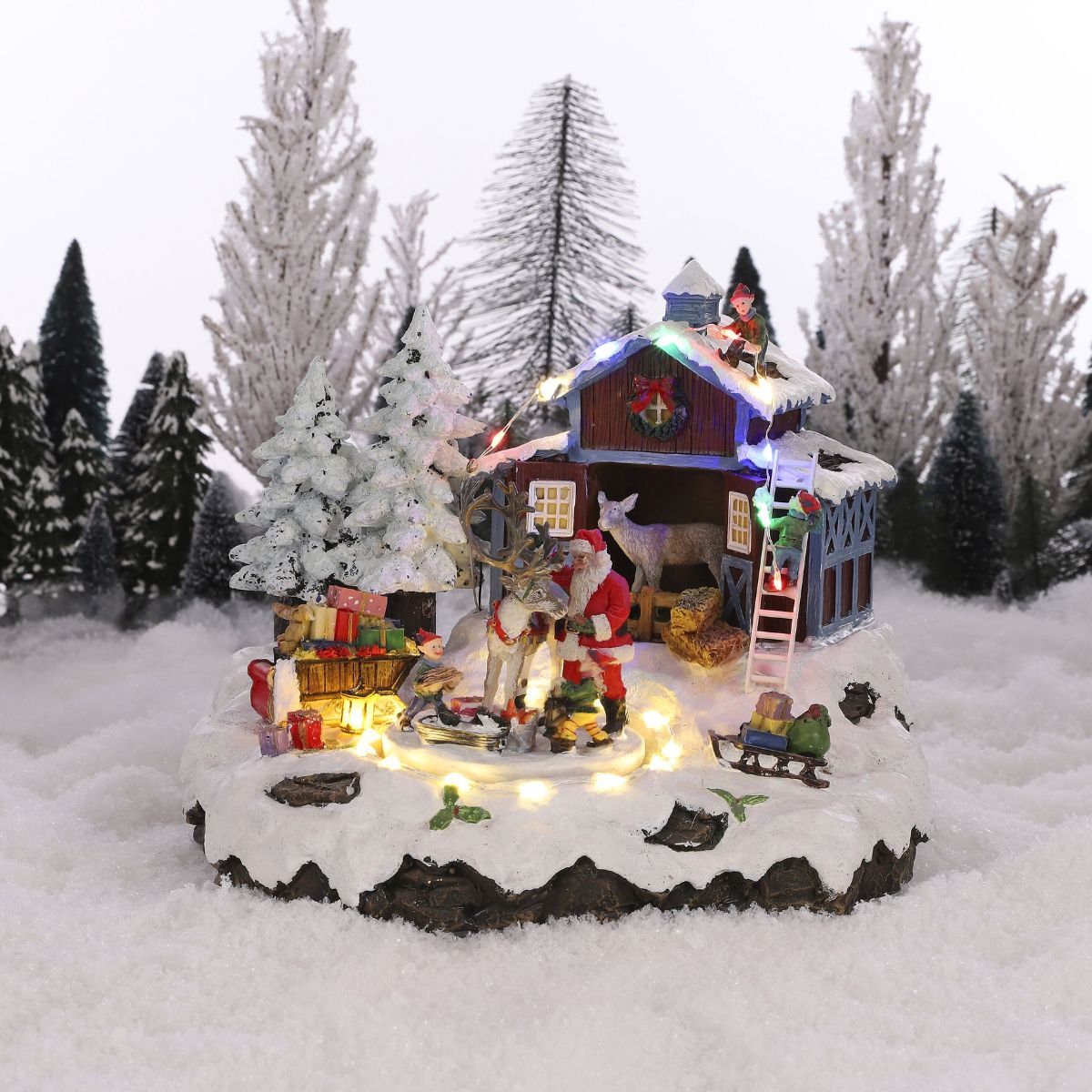 Kerstdorp tafereel met kerstman, elfjes en roterend plateau, 23,5 × 21 × 20 cm