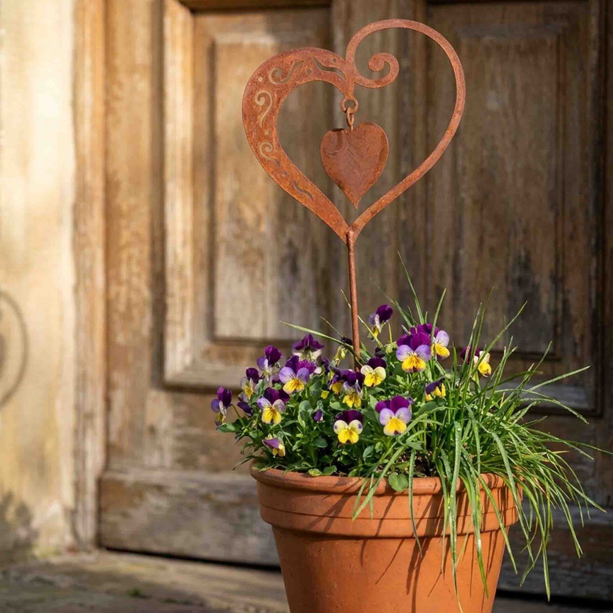 Hartdecoratie met bewegend binnenhart en roestpatina, hangend of met tuinsteker